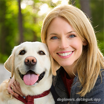 Dog Breeds and Dating Personalities - closeup of smiling woman and Labrador Retriever