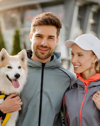 Online Dating for Dog Lovers - image of couple with dog outdoors